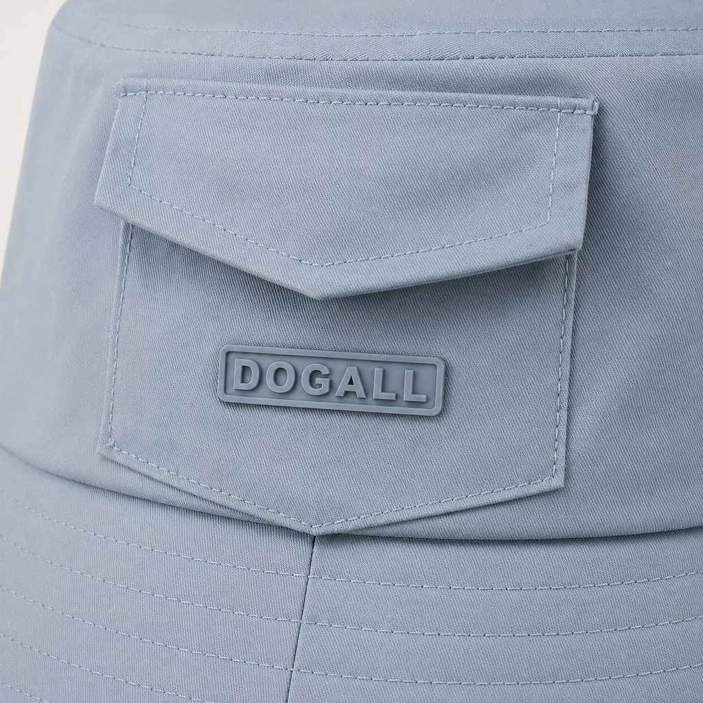 Close-up of custom 3D printed logo on the front pocket of a light blue polyester bucket hat