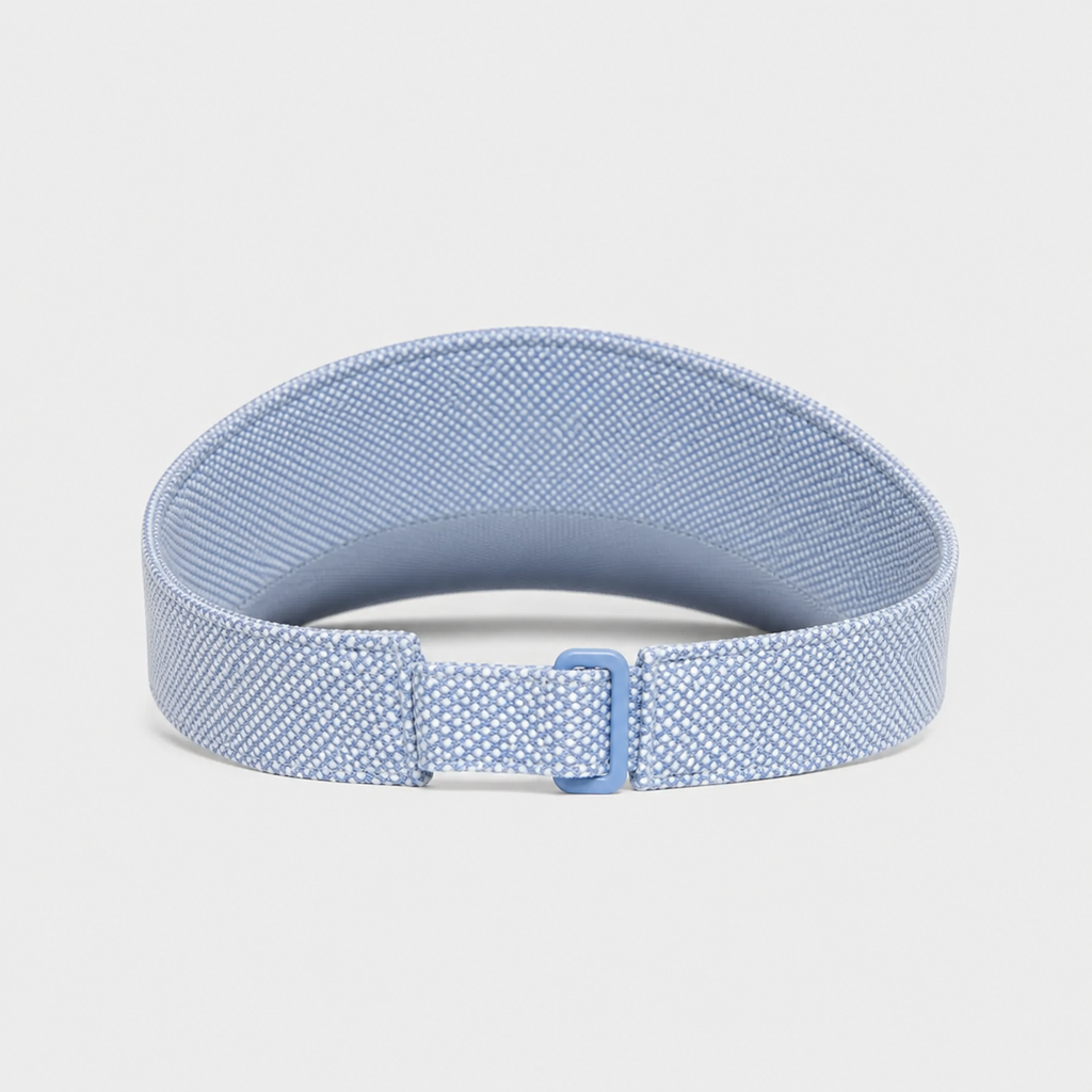 A light blue elastic fitness tracker strap with a textured pattern and a matching blue buckle, displayed on a neutral light gray background.