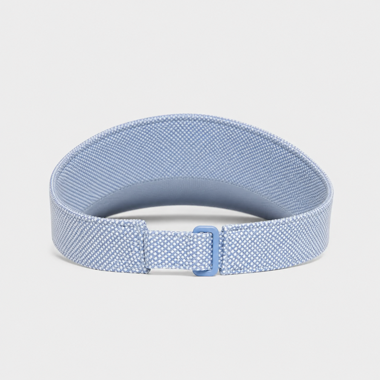 A light blue elastic fitness tracker strap with a textured pattern and a matching blue buckle, displayed on a neutral light gray background.