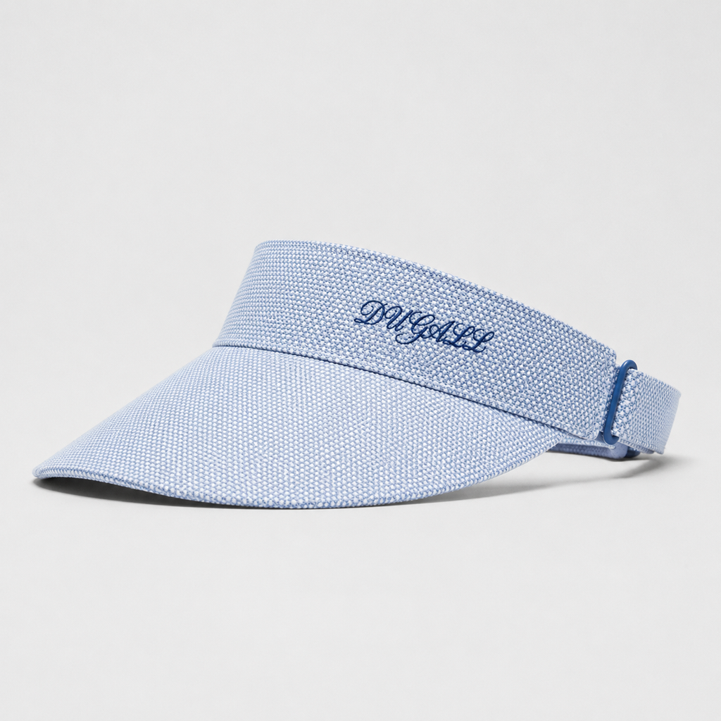 A light blue textured visor hat with a matching adjustable strap, featuring the brand name 'D'AGUIL' embroidered in navy blue on the front band, set against a plain light gray background.