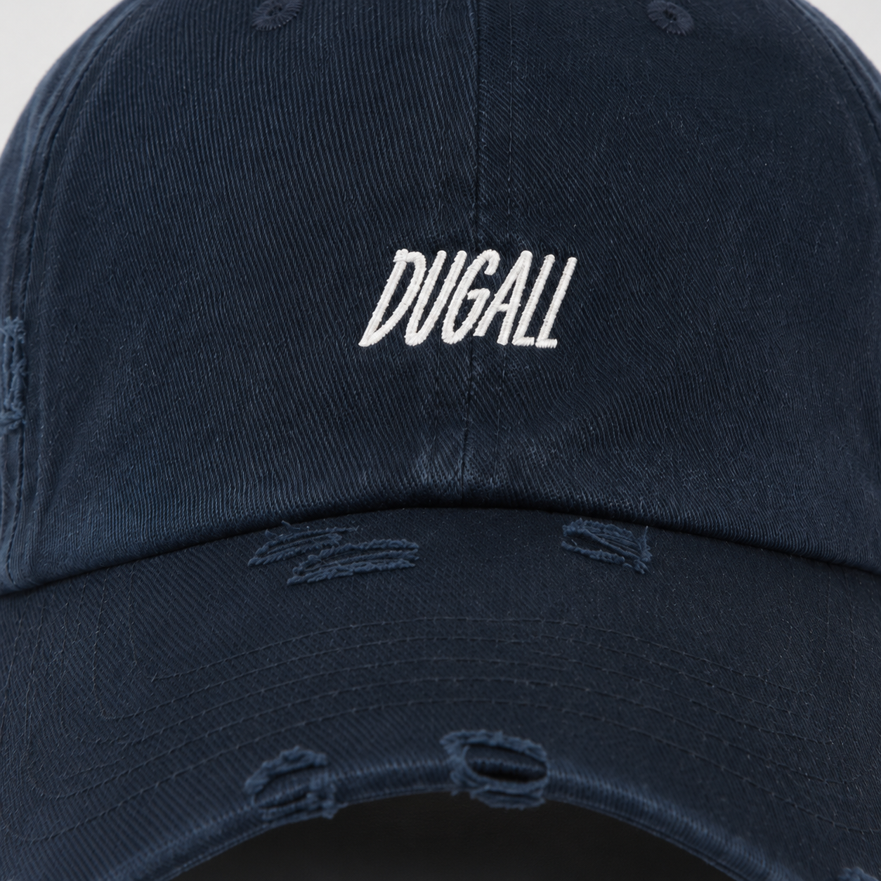 Close-up of custom embroidery logo on washed cotton baseball cap