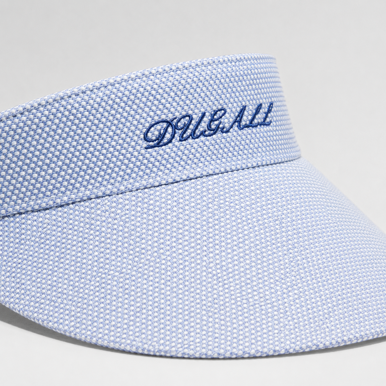 A light blue textured visor hat with the brand name 'DIBALL' embroidered in dark blue script on the front band, shown against a neutral light gray background.