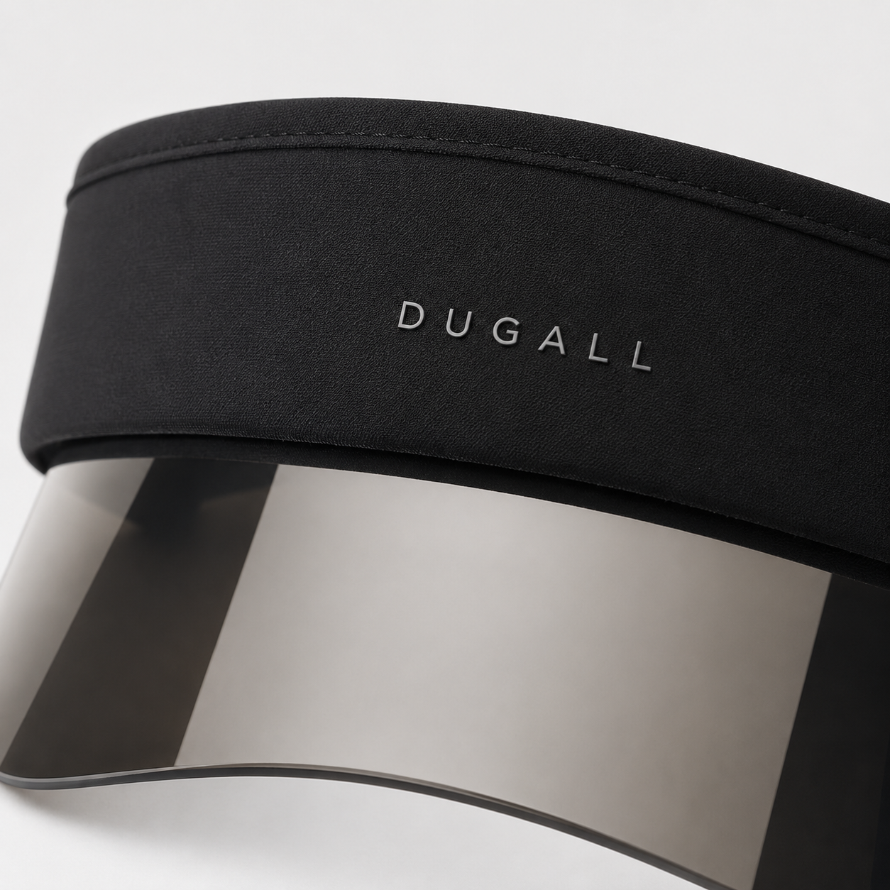 Close-up of custom logo on black cotton headband with transparent visor panel