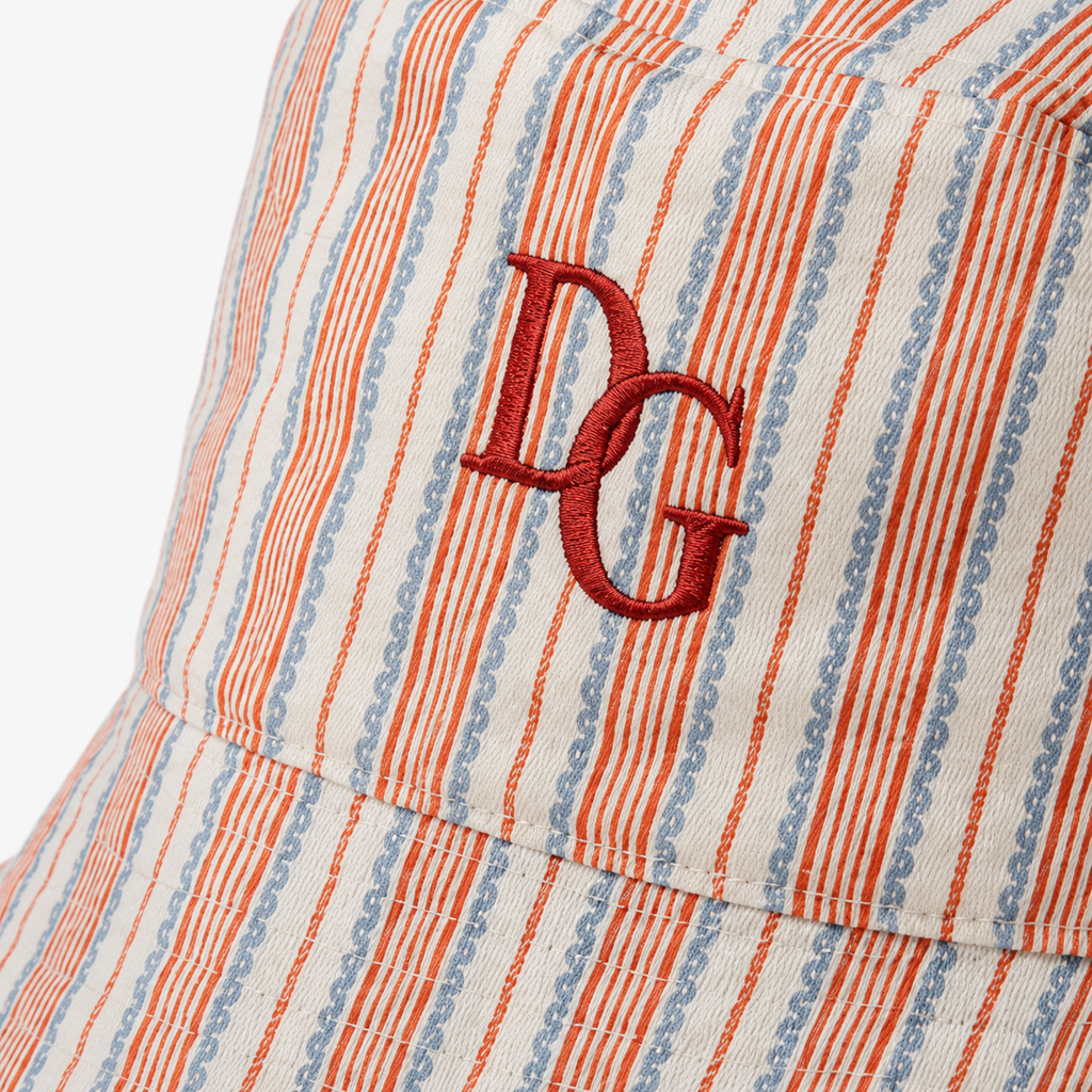 Close-up of embroidered logo on custom cotton striped bucket hat