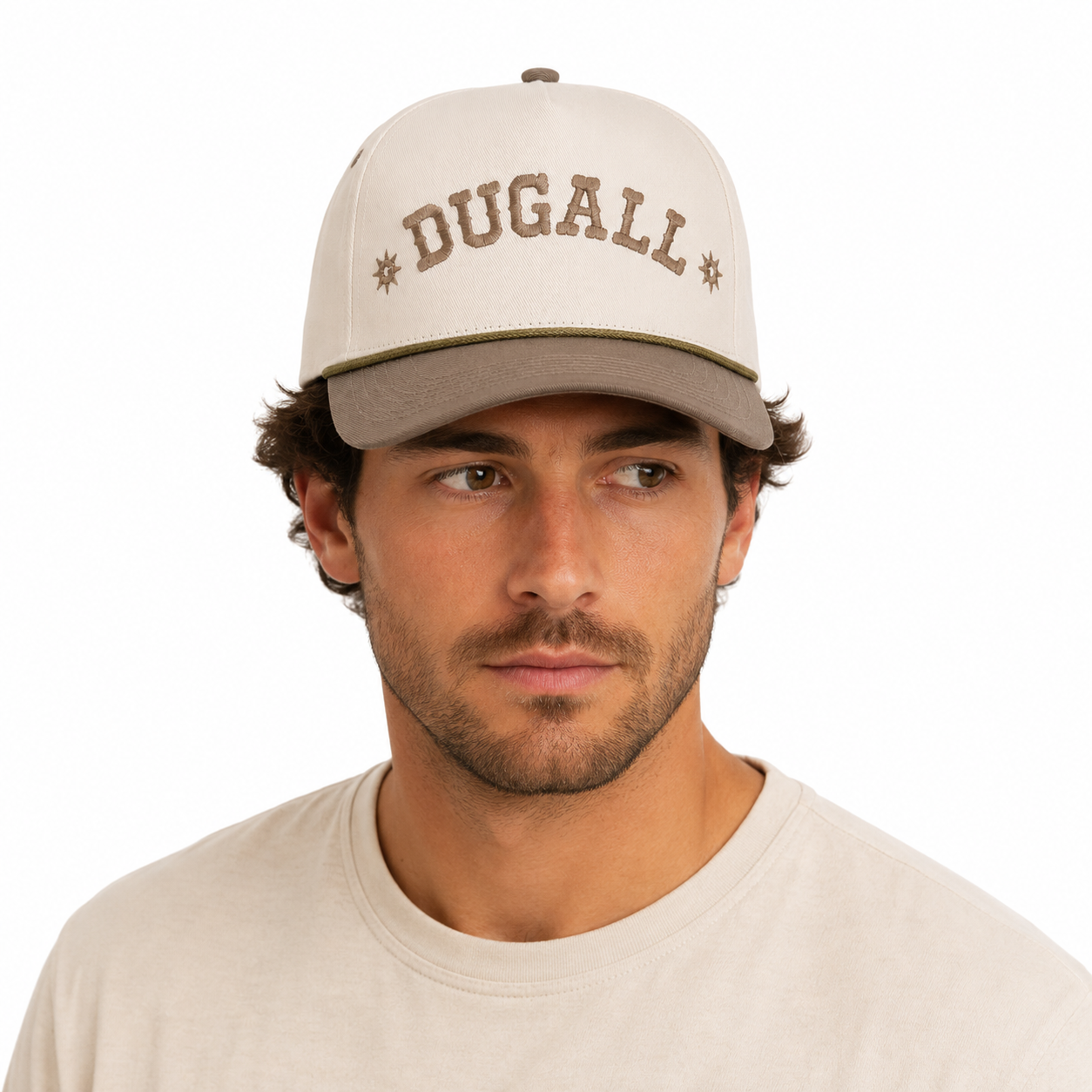 Model wearing distressed denim baseball cap with custom embroidered logo