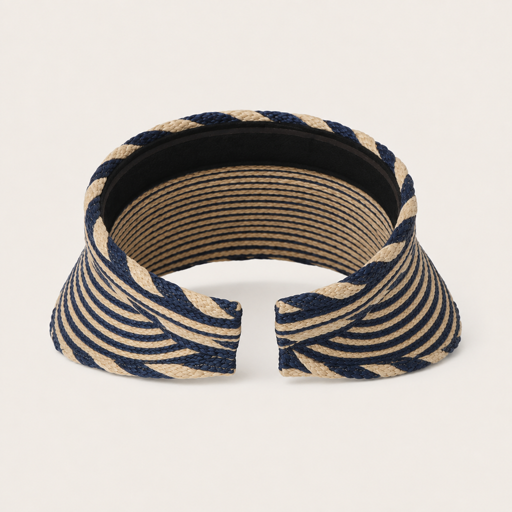 A woven visor-style headband with a navy blue and beige striped pattern, shown against a plain off-white background.