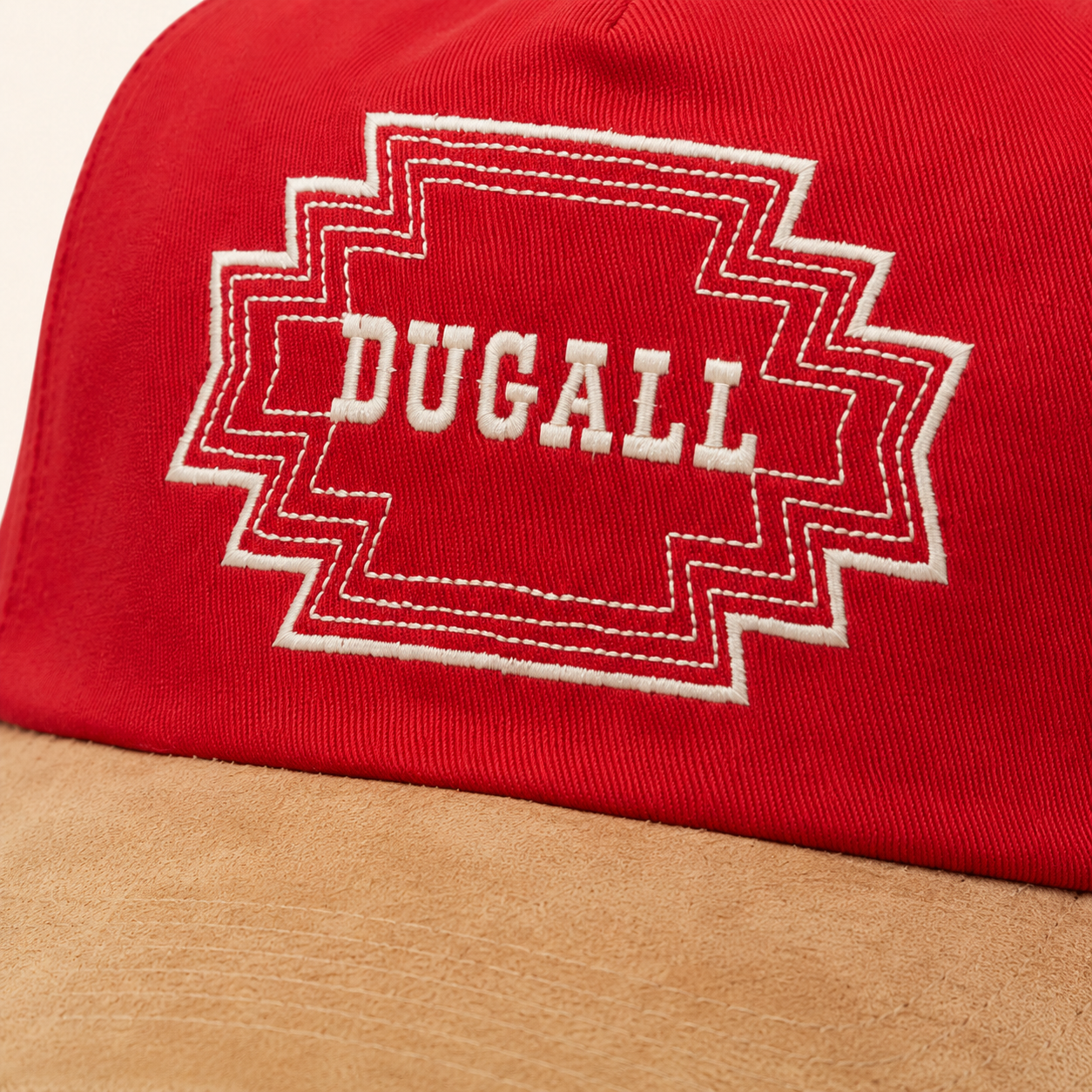 Close-up of custom embroidered logo on cotton suede brim cap