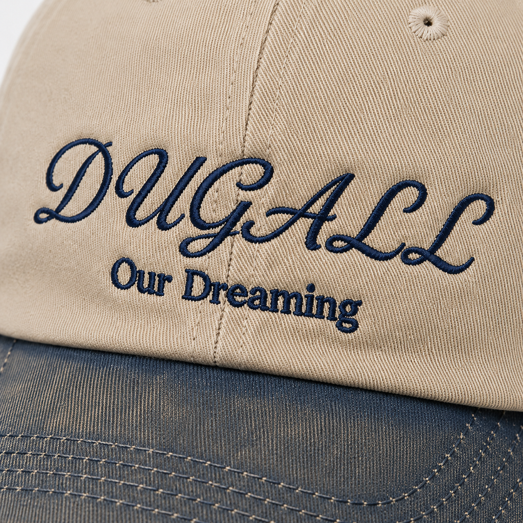 Close-up of custom script embroidery on washed cotton cap