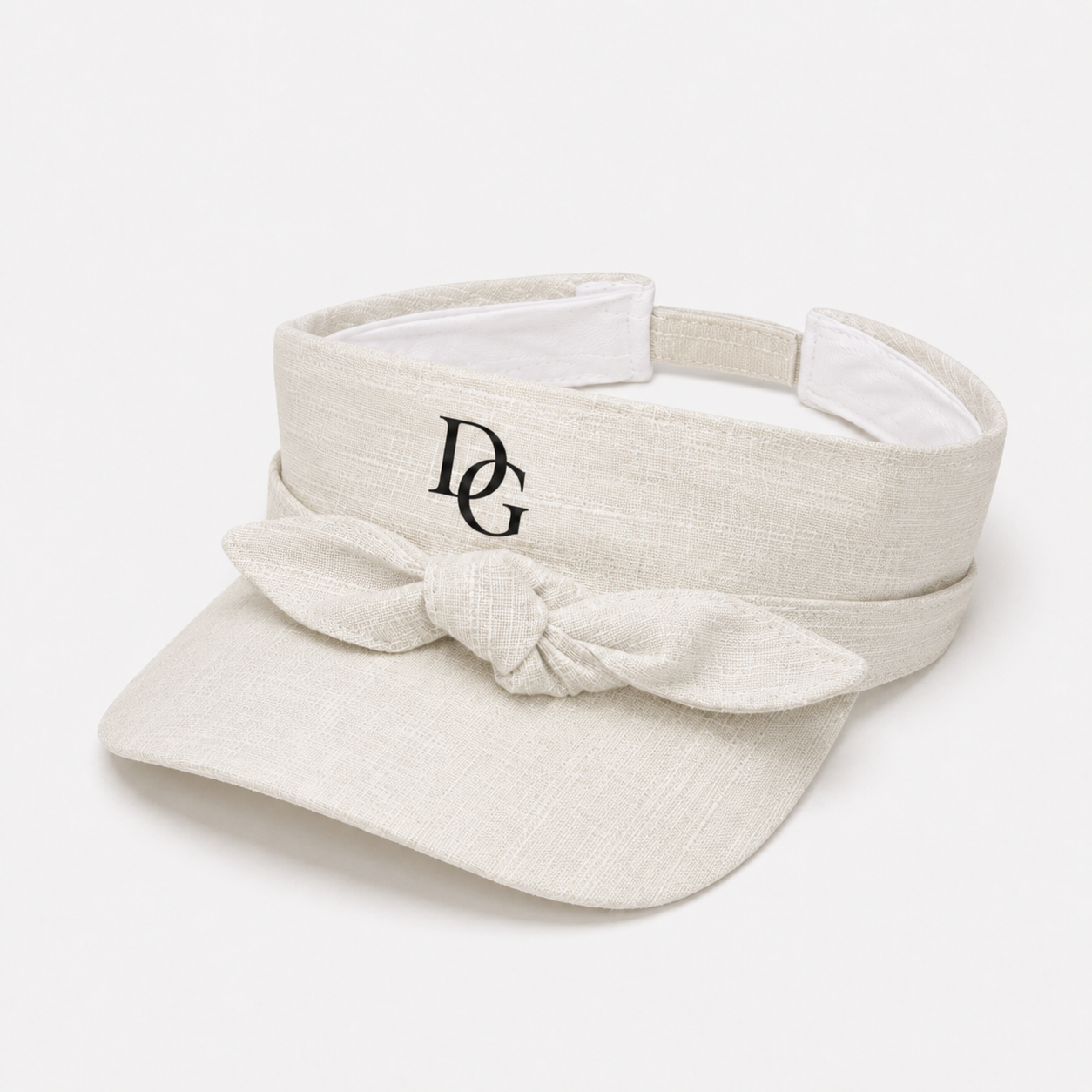 Side view of a custom embroidered sports sun visor made with lightweight polyester fabric and front bow tie detail.
