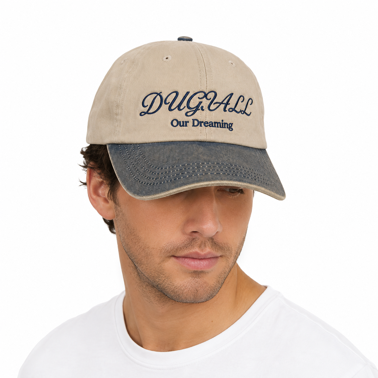 Model wearing two tone washed baseball cap with embroidered logo