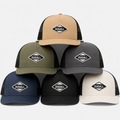 Multiple color options of custom embroidered cotton twill trucker hats with breathable mesh back.