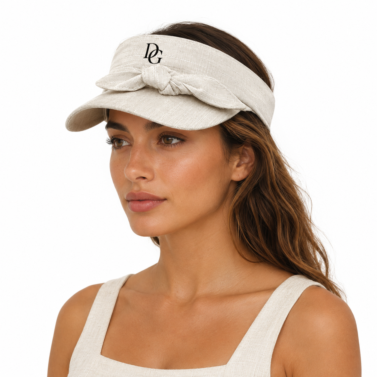 Female model wearing a custom quick dry sports visor with bow tie design for tennis, golf, resort, and outdoor sun protection.