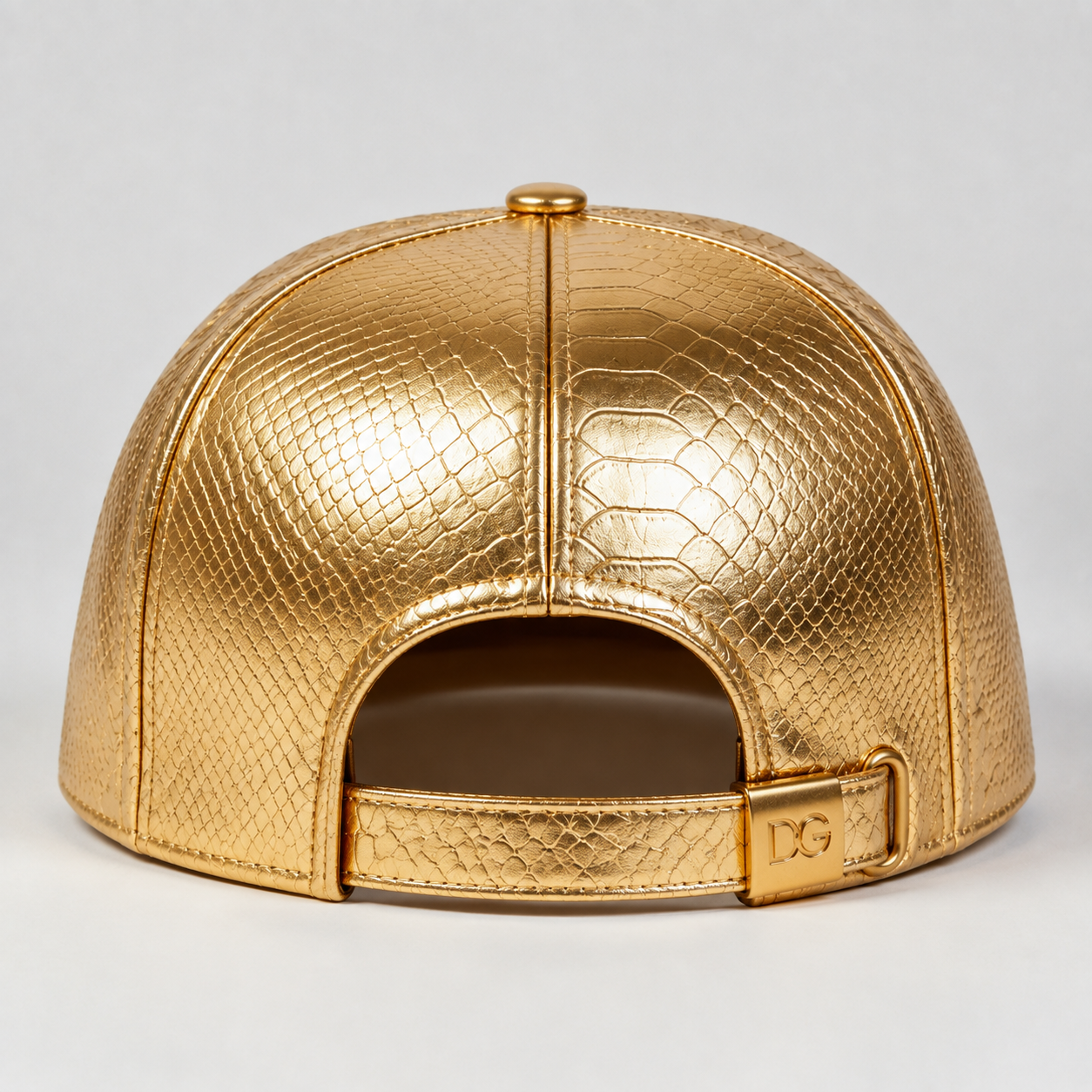 Back view of a custom gold PU flat brim cap with adjustable back strap and embossed faux leather texture.