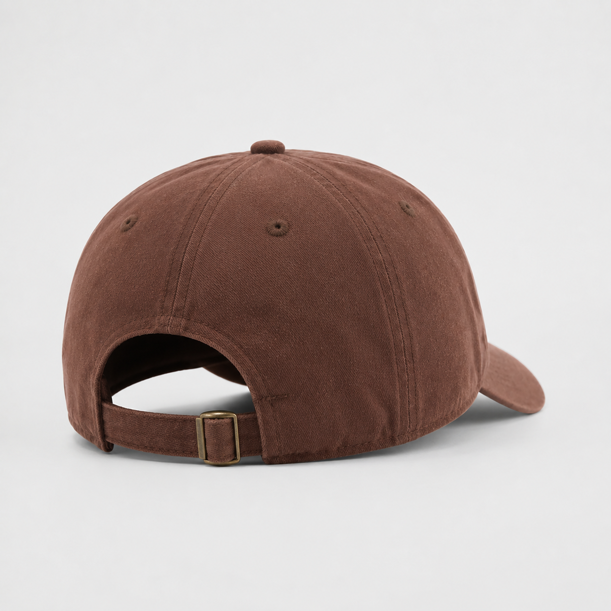 Back view of a brown custom cotton snapback hat with adjustable metal buckle strap and clean 6 panel construction.