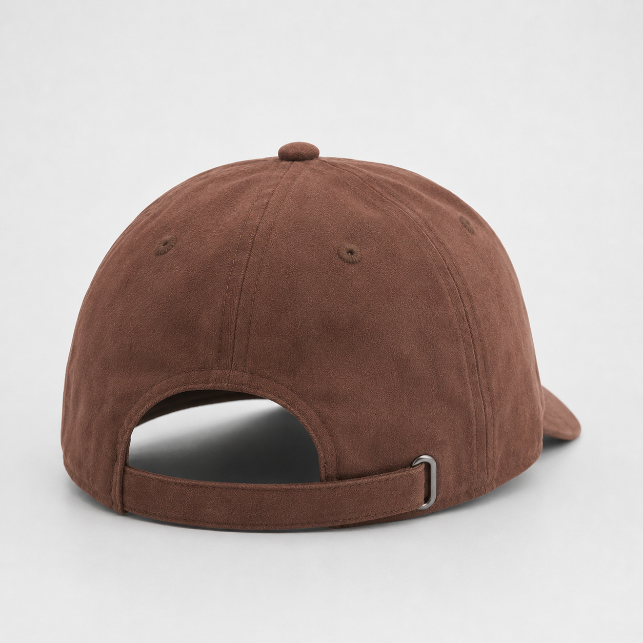 Back view of a coffee brown washed cotton dad hat with adjustable strapback closure and metal buckle.