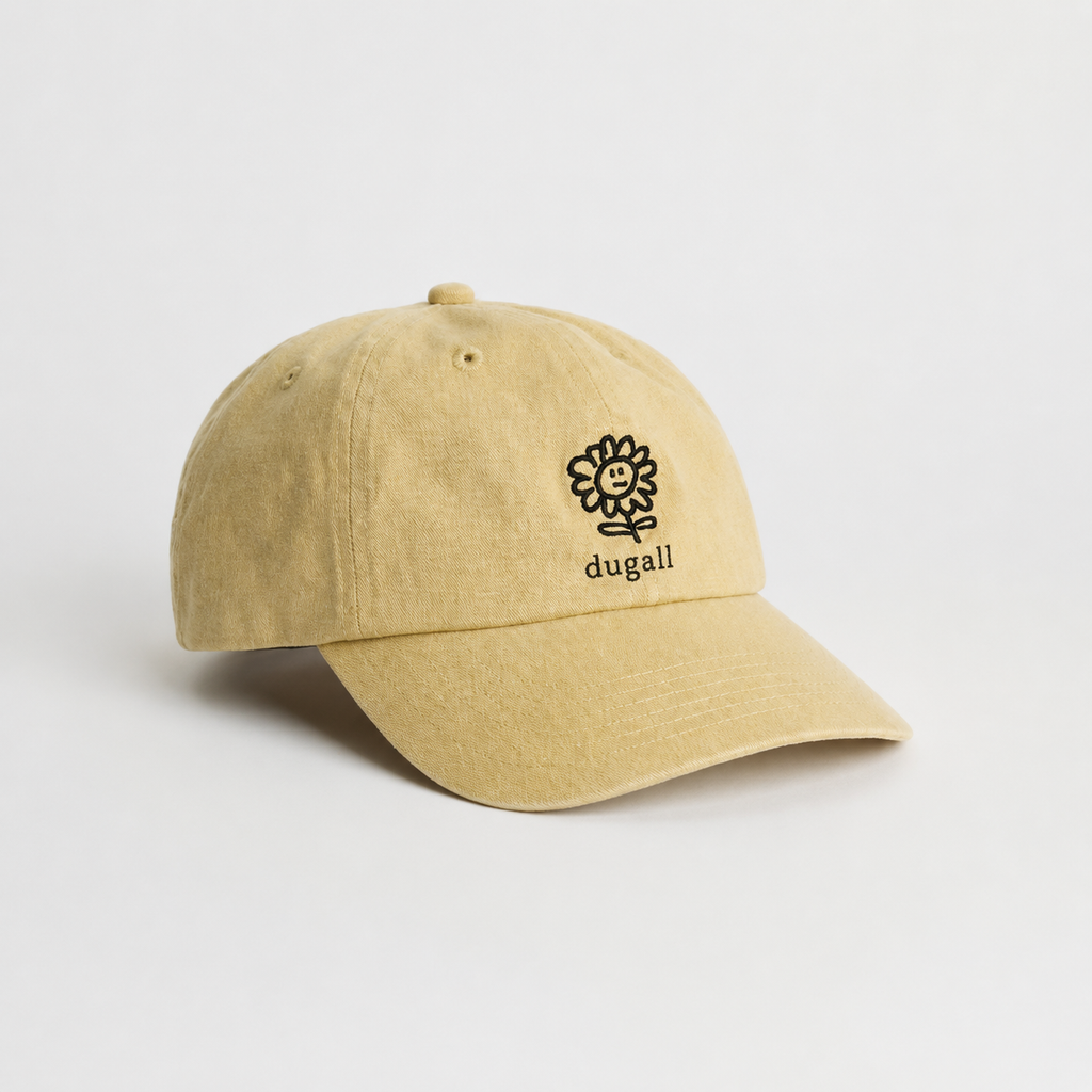 Flat lay view of a beige 100% cotton dad hat with curved brim and clean custom embroidery placement