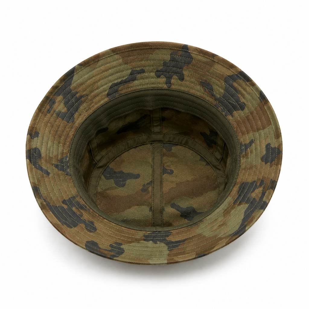 Inside view of a custom camouflage bucket hat showing the washed cotton inner construction and brim stitching.