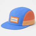 Front view of a custom color block nylon 5 panel baseball cap with patch label logo and flat brim.