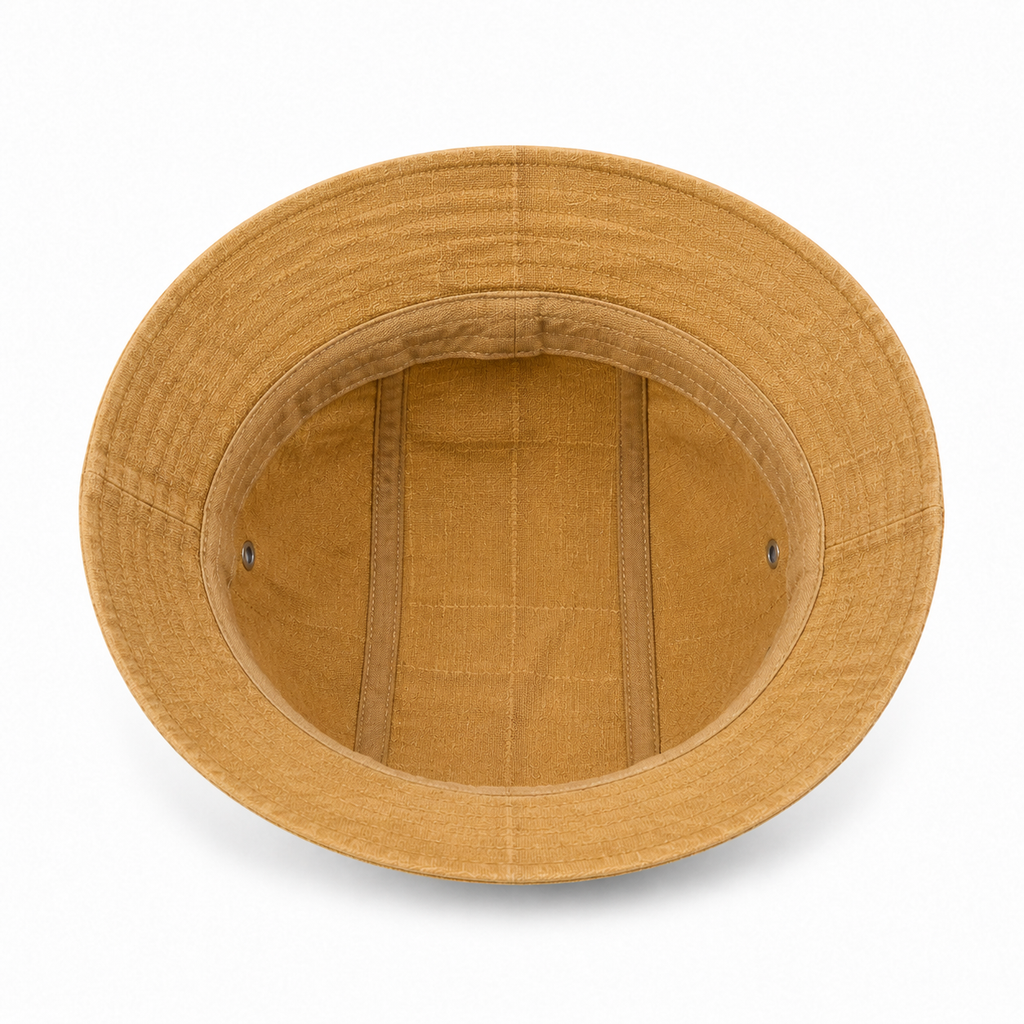 Inside view of a custom cotton linen bucket hat showing the breathable interior construction and soft brim structure.