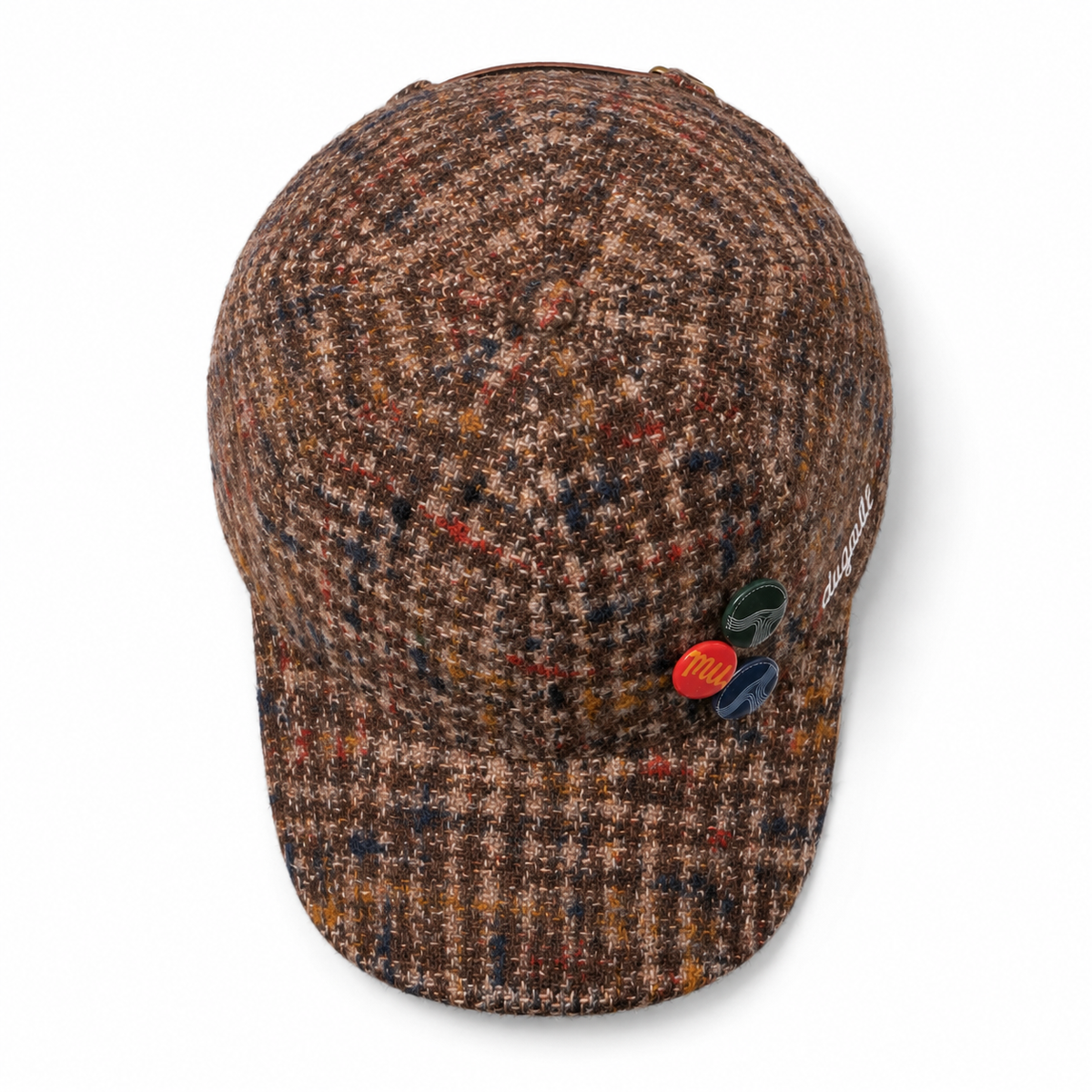 Top view of a custom 100% wool six-panel baseball cap with multicolor textured fabric, curved brim and decorative buttons.