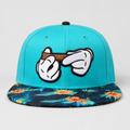Front view of a custom cotton snapback hat with cartoon embroidery design and printed flat brim in a hip hop streetwear style.