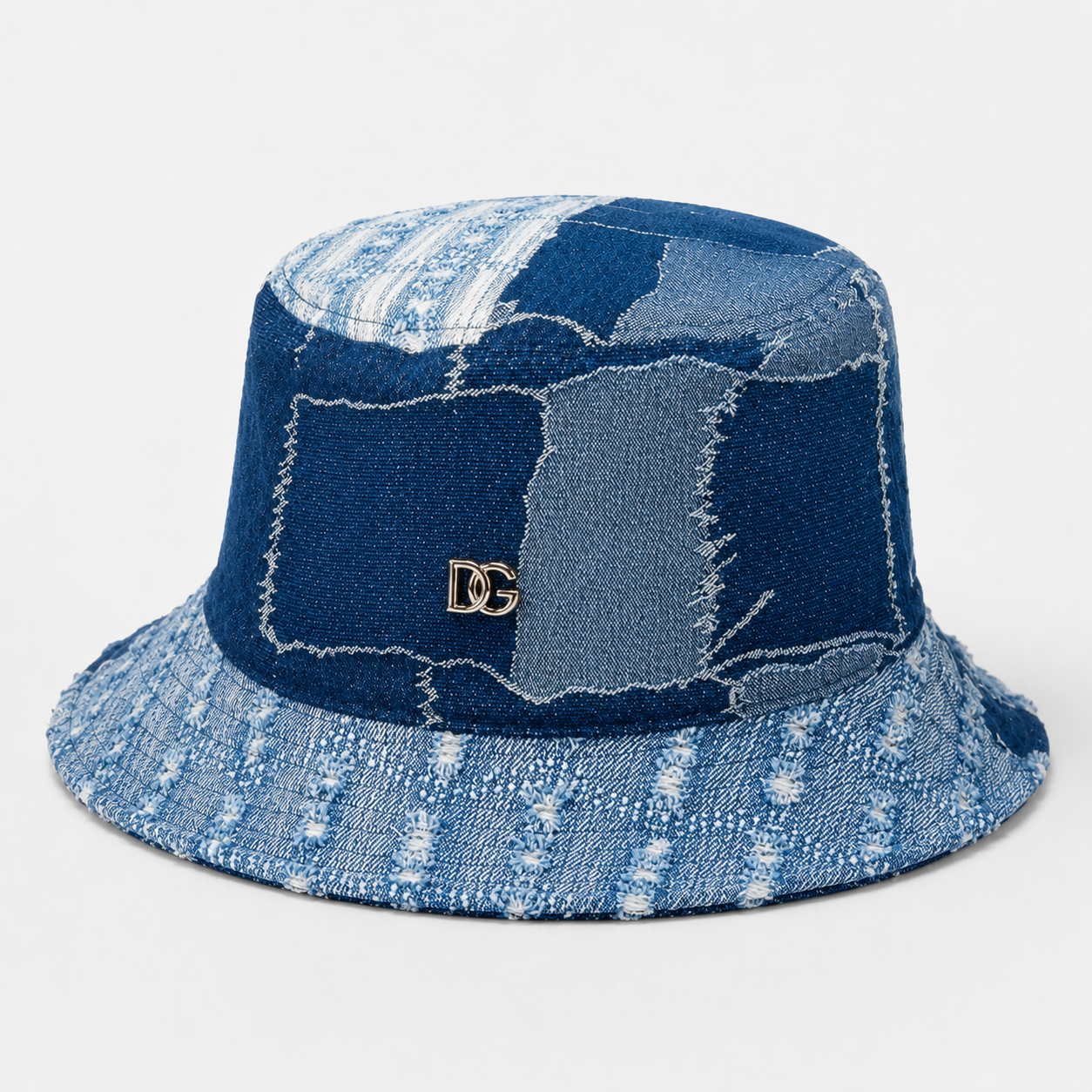 Front view of a custom denim bucket hat with patchwork panels and custom metal logo