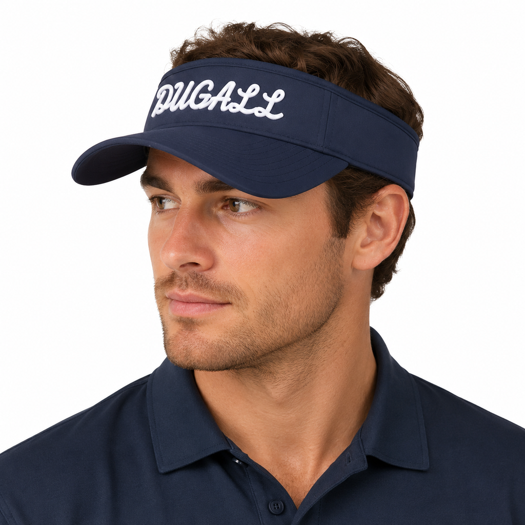 A man wearing a navy blue visor with 'PGA/LL' embroidered in white script on the front, paired with a matching navy polo shirt, against a plain white background.