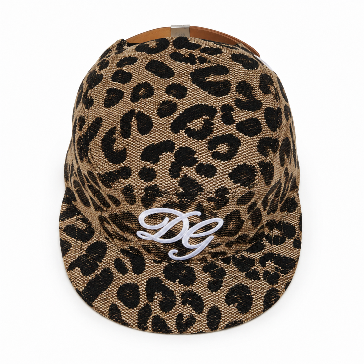Top view of a custom leopard print flat brim baseball cap showing full animal print pattern and embroidered front logo.