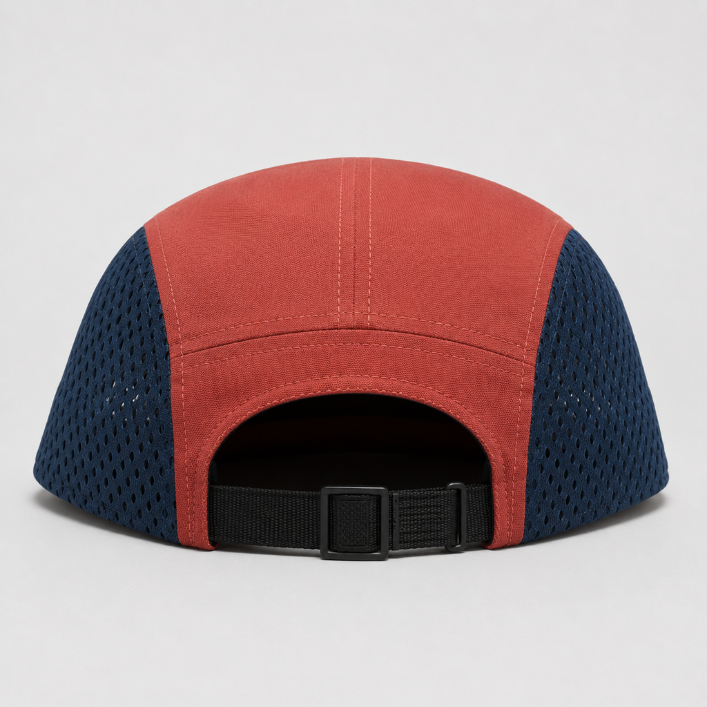 Back view of a custom mesh 5 panel cap with navy polyester mesh side panels and adjustable black webbing strap.