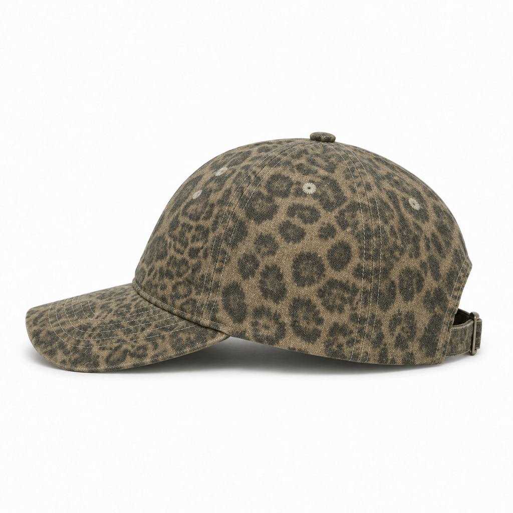 Side view of a six-panel leopard print dad hat with curved brim and custom rhinestone logo
