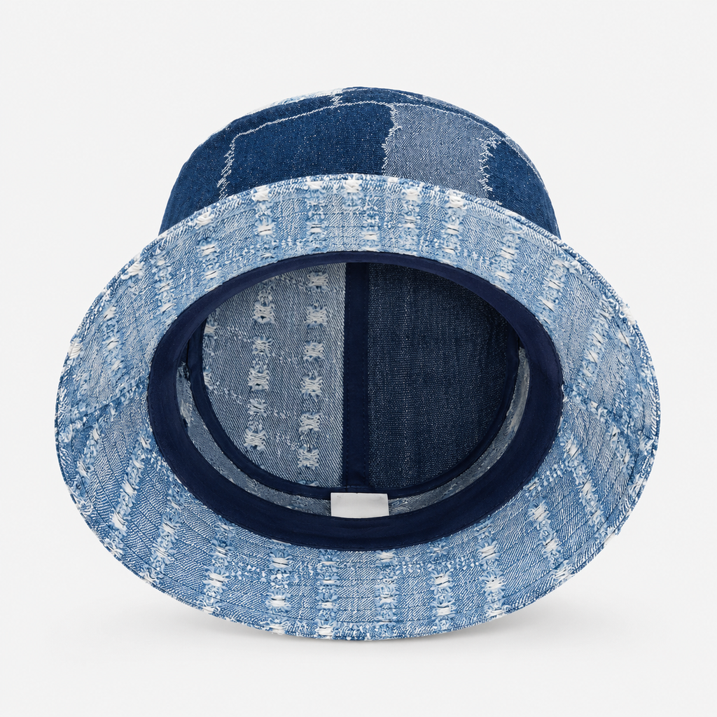 Inside view of a custom denim bucket hat showing patchwork construction and inner stitching details