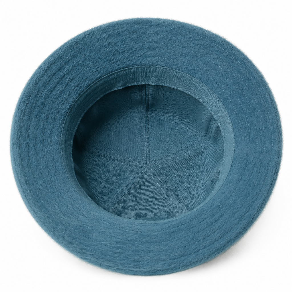 Inside view of a custom faux fur bucket hat showing the inner construction and soft seasonal structure.