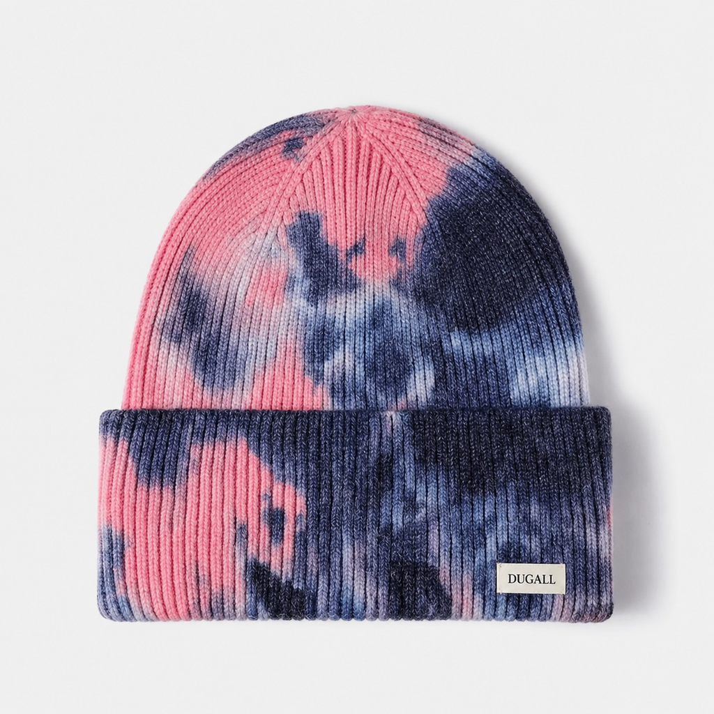 Front view of a pink and navy tie dye acrylic beanie with folded cuff and custom logo label.