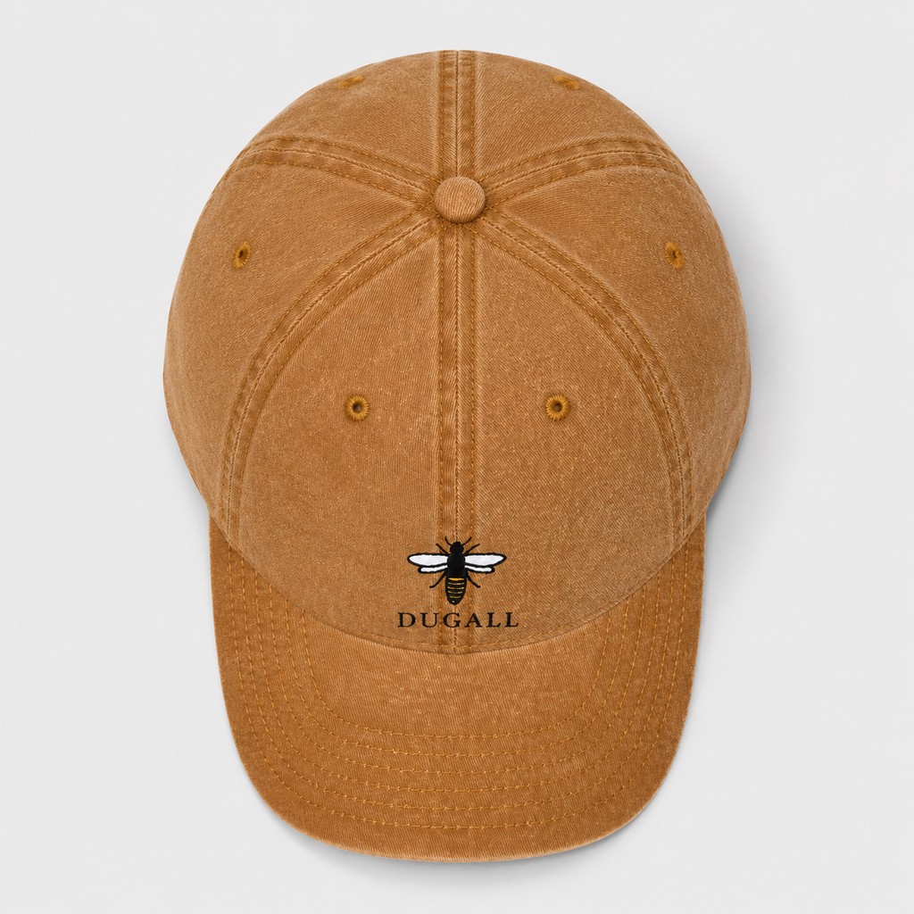 Top view of a honey brown washed cotton dad hat showing six panel construction and bee logo placement.