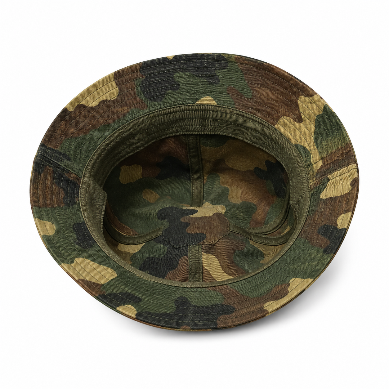 Inside view of a custom washed cotton camouflage bucket hat showing the interior structure.
