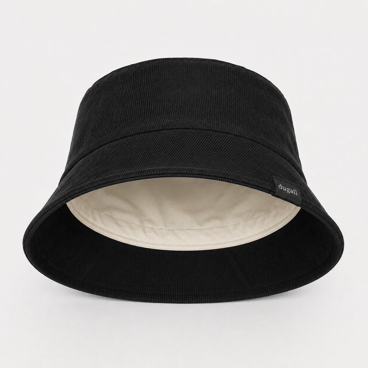 Inside view of black cotton bucket hat showing soft brim construction and inner lining detail