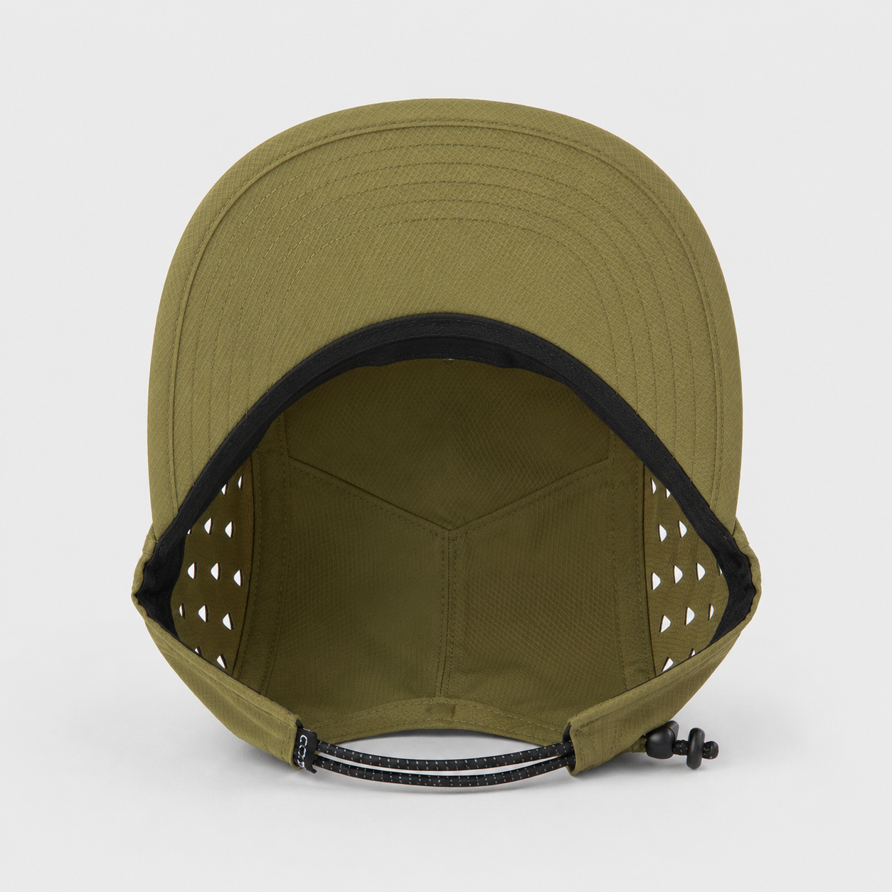 Inside view of a quick-dry polyester outdoor 5 panel cap showing breathable side cutouts, flat brim, and adjustable rear cord.