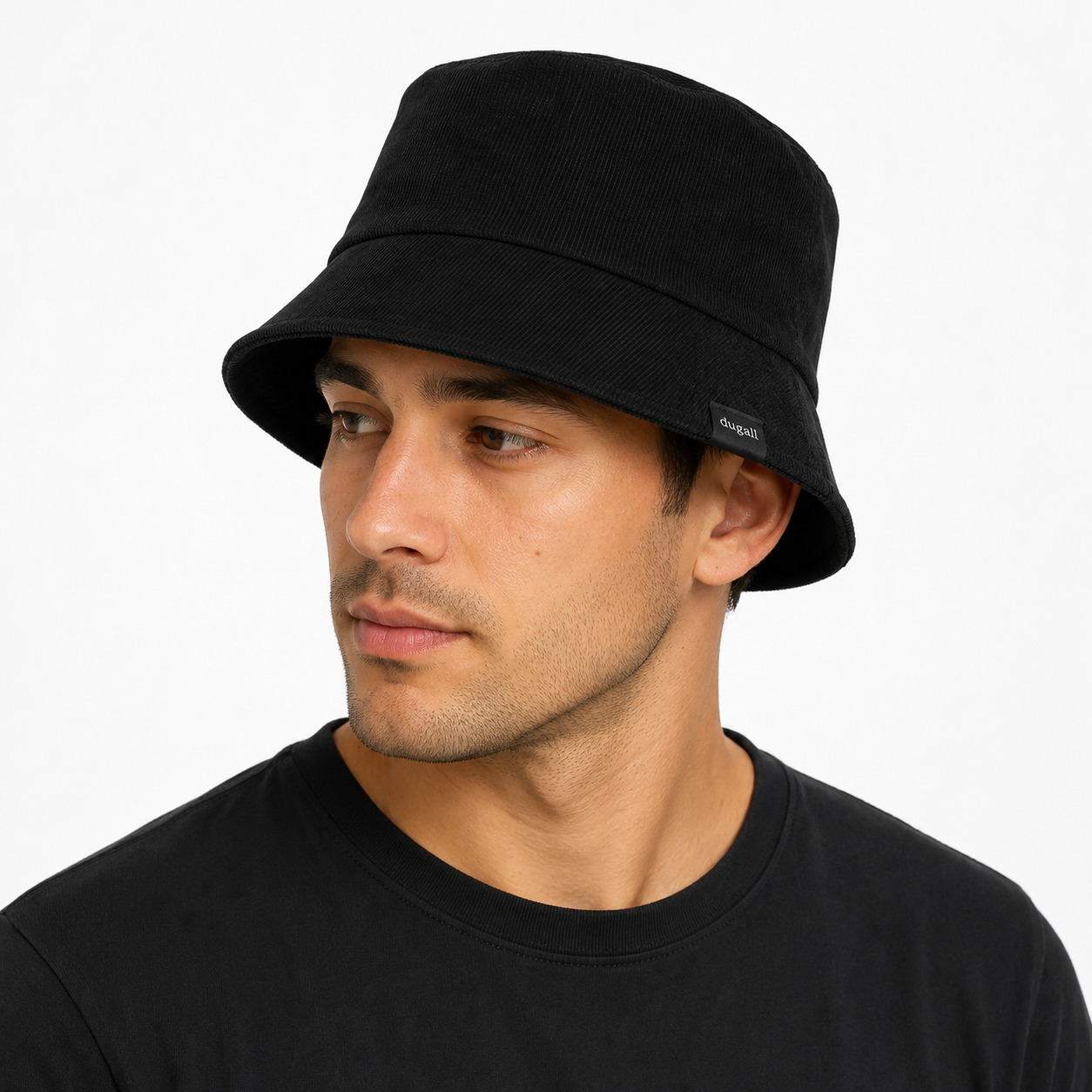 Male model wearing a black cotton custom bucket hat with minimalist side woven label logo