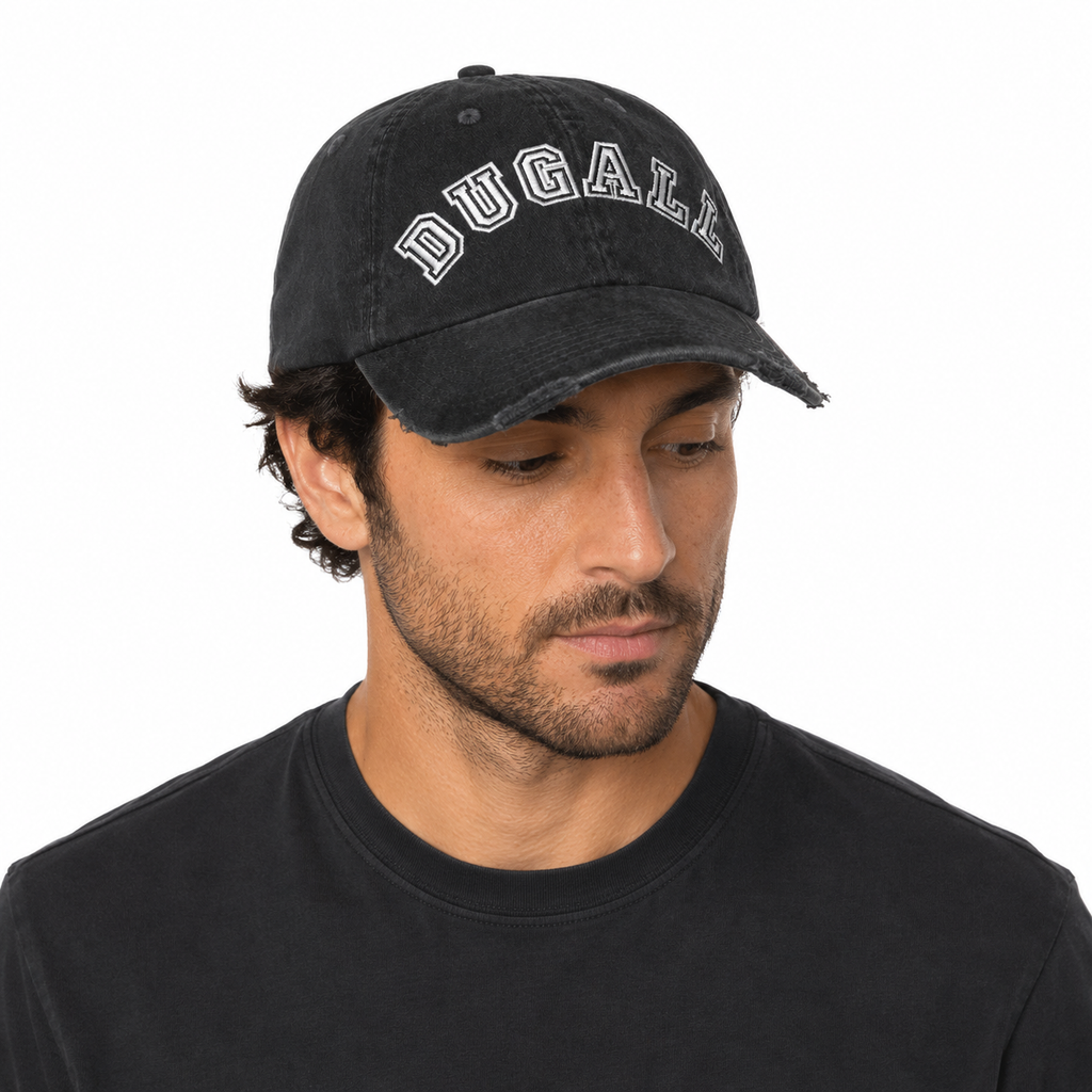 Man wearing a black washed cotton dad hat with custom embroidery logo and relaxed vintage styling.