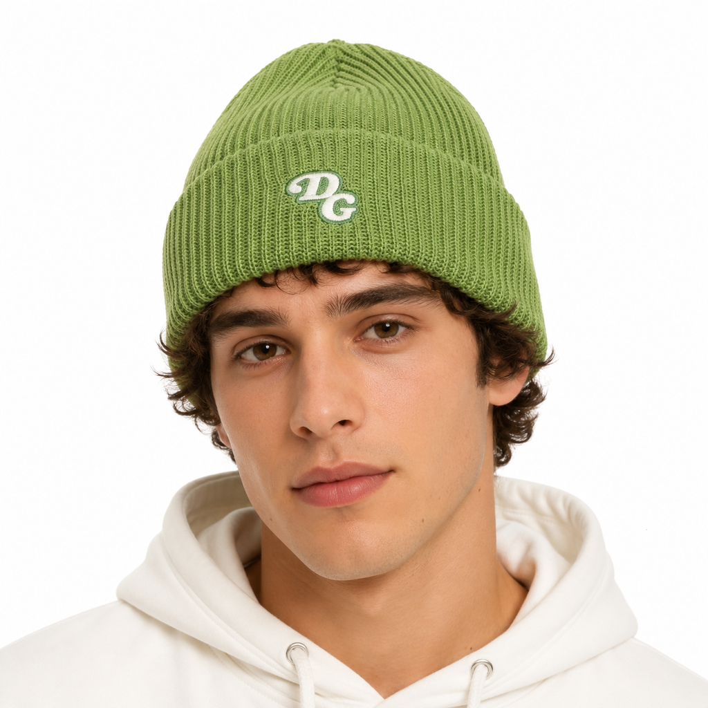 Male model wearing a green acrylic ribbed beanie with custom embroidered DG logo.