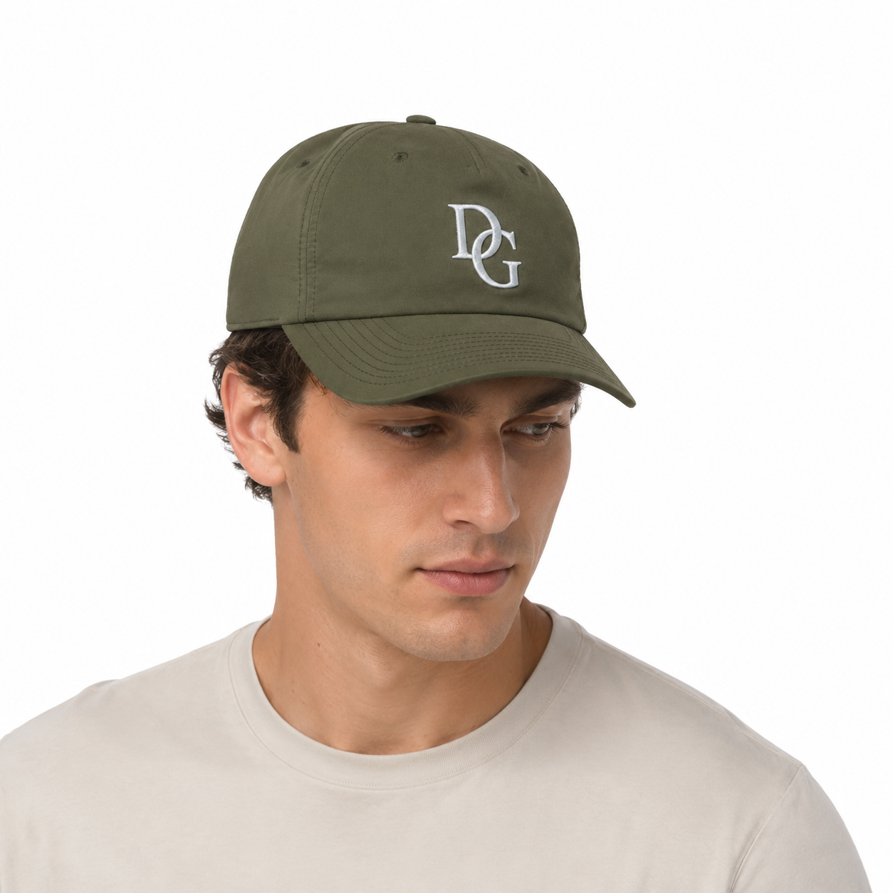 Male model wearing an olive cotton twill 5 panel baseball cap with white embroidered logo.
