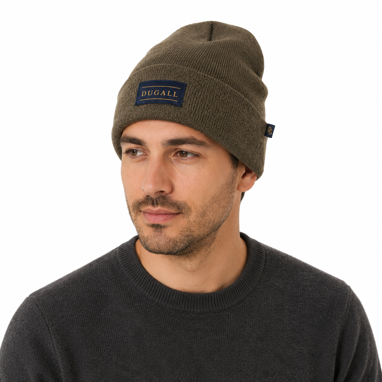Male model wearing an olive brown acrylic knit beanie with custom patch label logo.