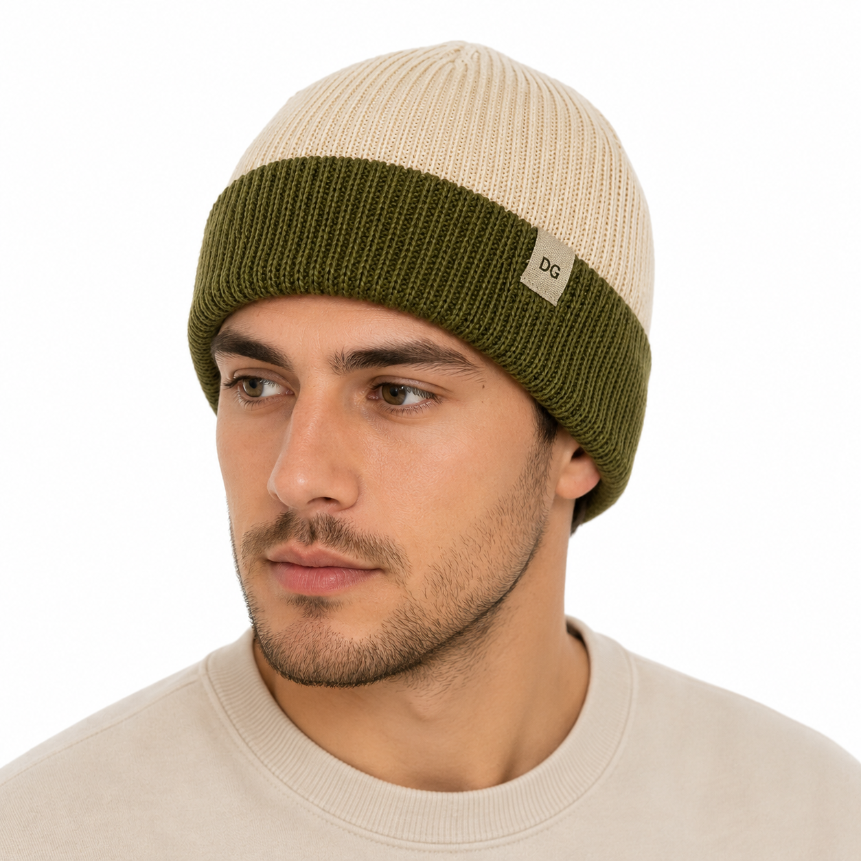 Male model wearing a cream and olive short color block beanie styled with casual modern clothing
