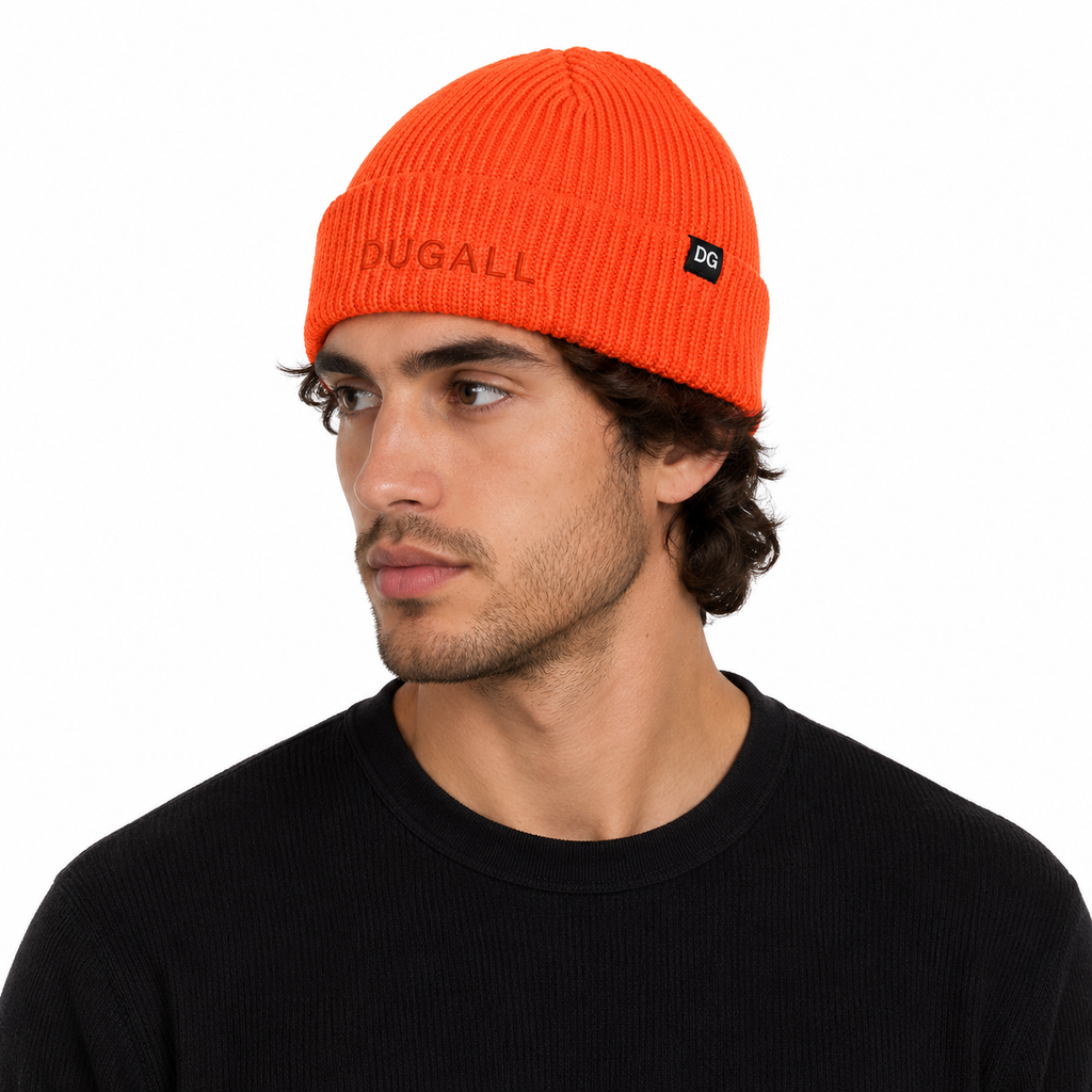 Male model wearing a custom orange short beanie with front embroidery and side label logo in a casual streetwear look