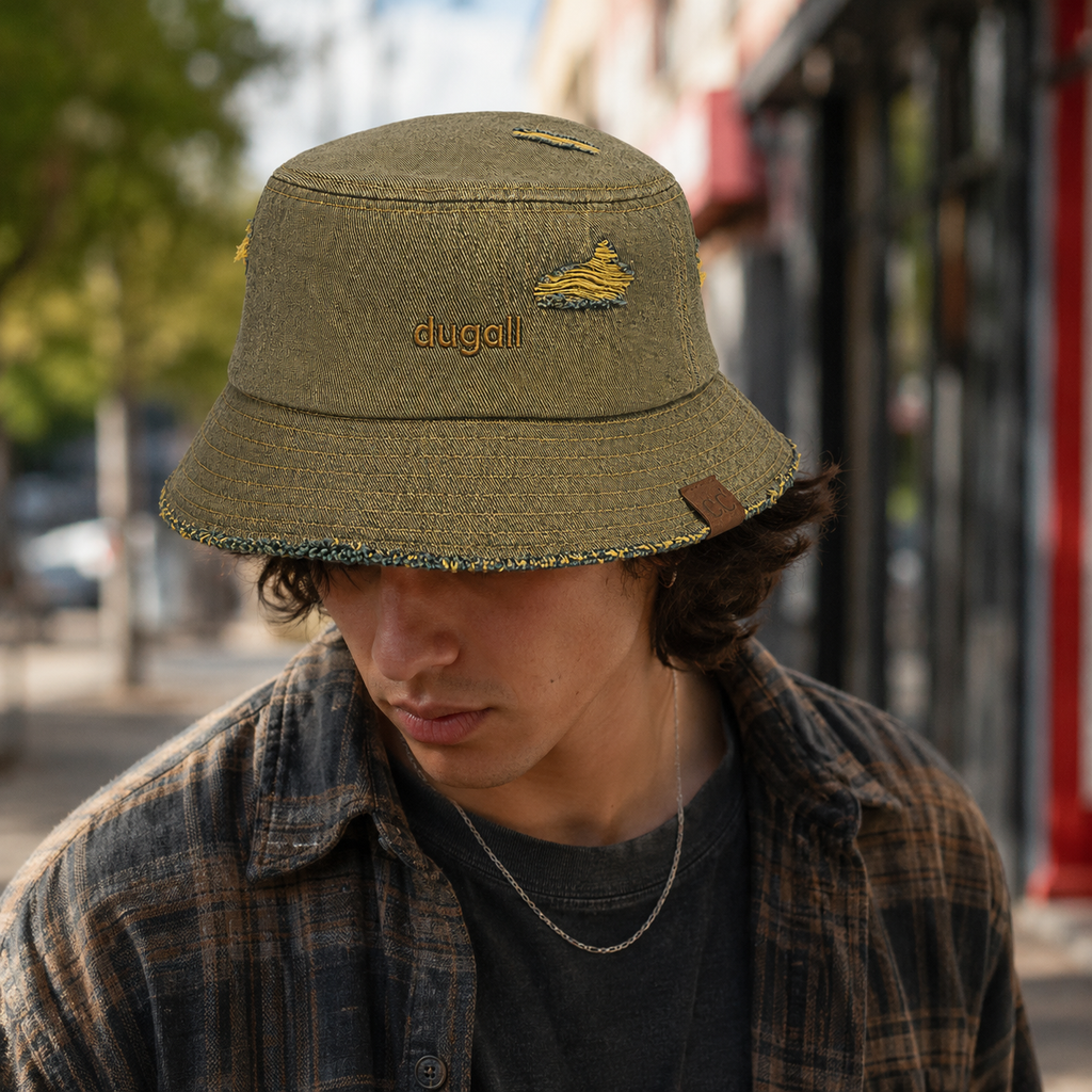 Male model wearing a custom washed cotton bucket hat with embroidery logo in an urban outdoor streetwear setting