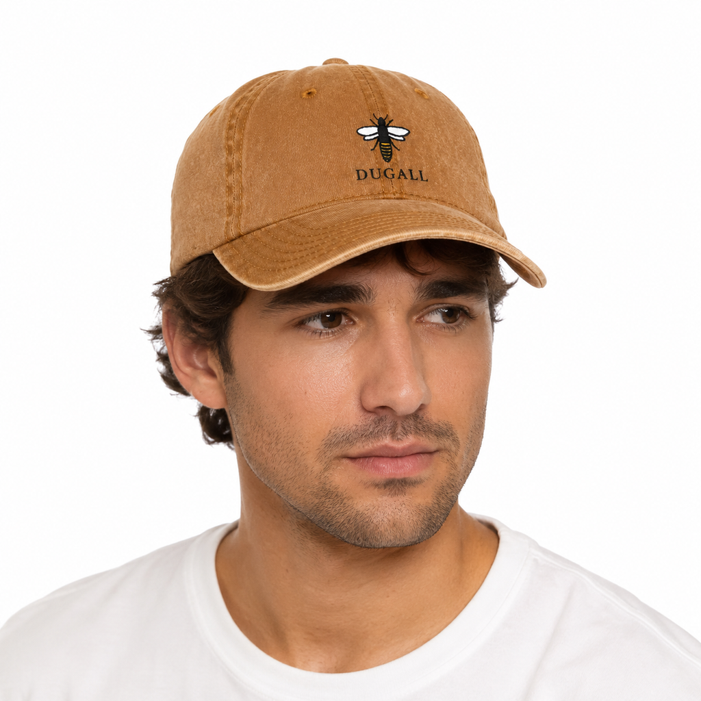 Male model wearing a washed cotton dad hat with bee embroidery logo and adjustable strapback.
