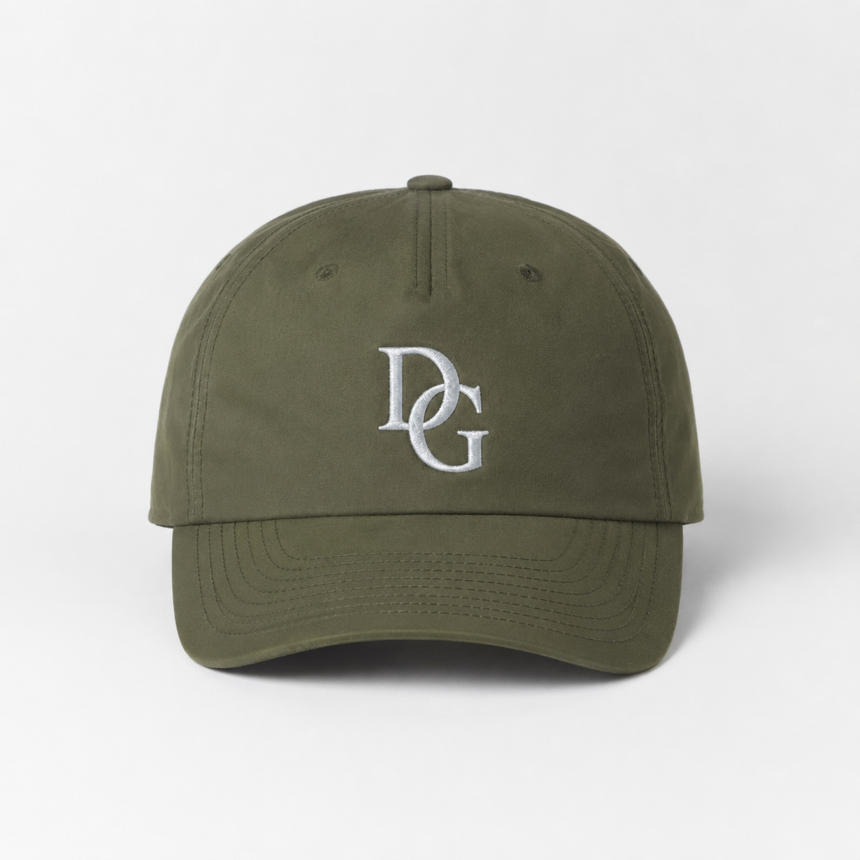 Front view of an olive green cotton twill 5 panel cap with white custom embroidered DG logo and curved brim.