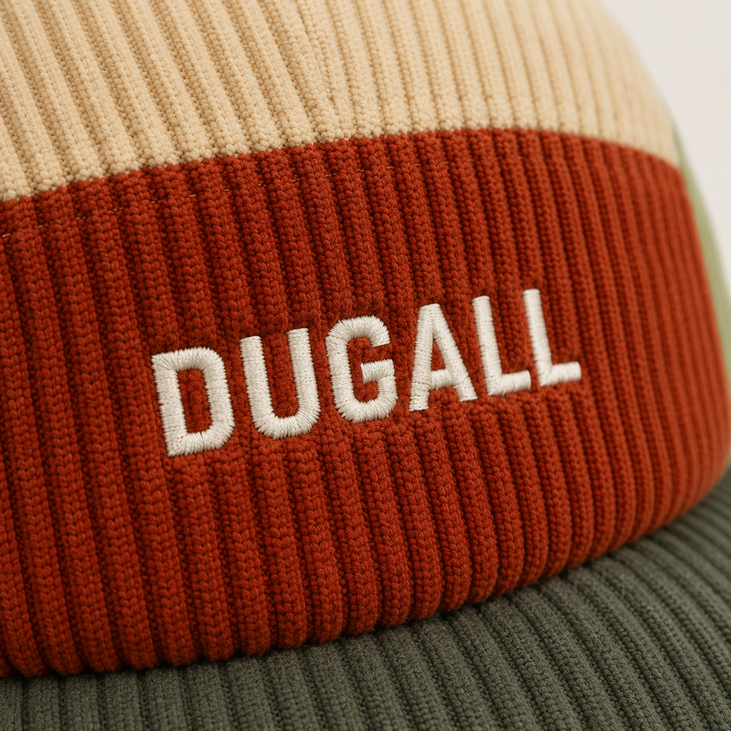Close-up detail of embroidered logo on custom color block corduroy baseball cap