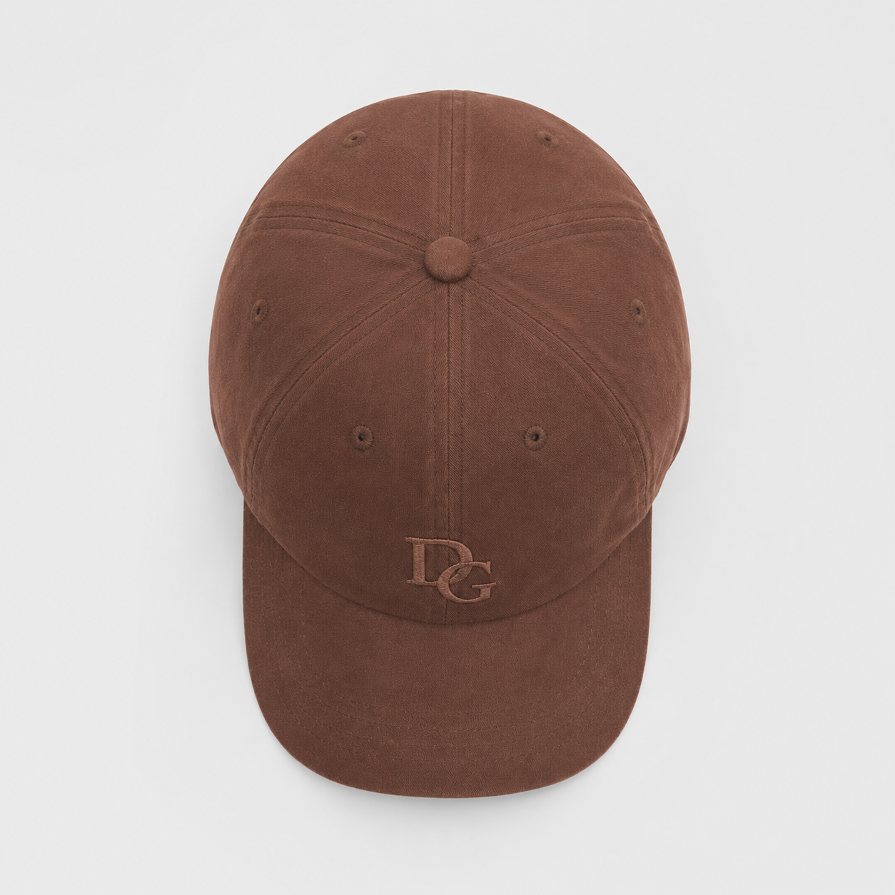 Top view of a coffee brown washed cotton dad hat showing six panel construction and embroidered logo placement.