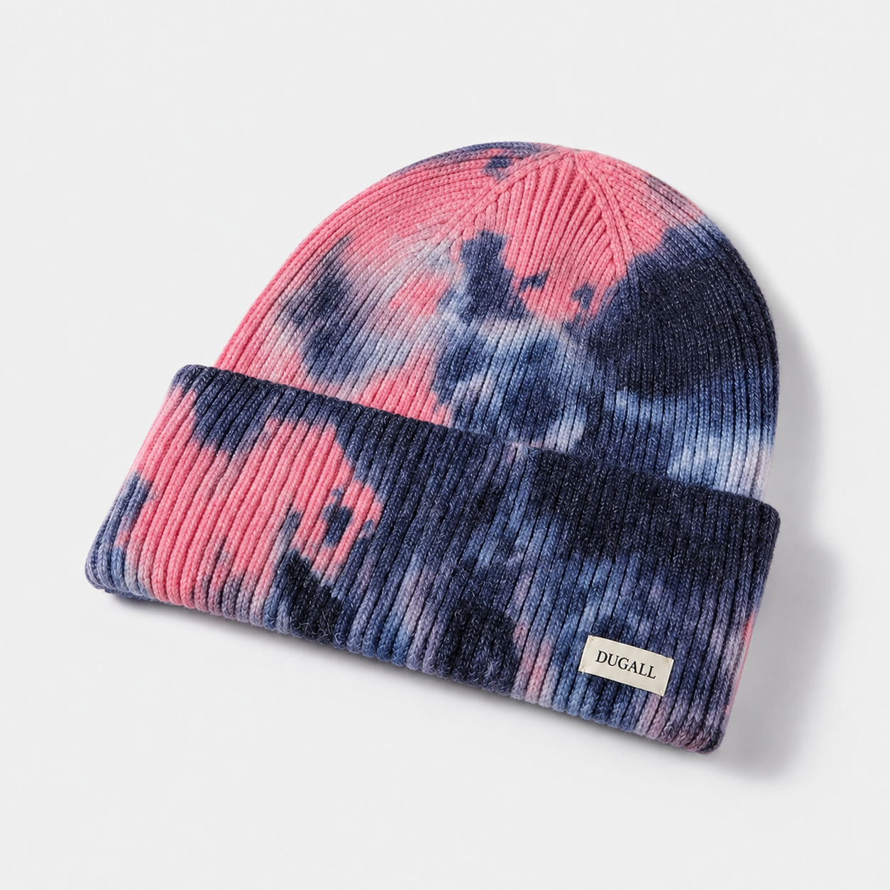 Colorful tie dye acrylic beanie with folded cuff and custom DUGALL logo label.